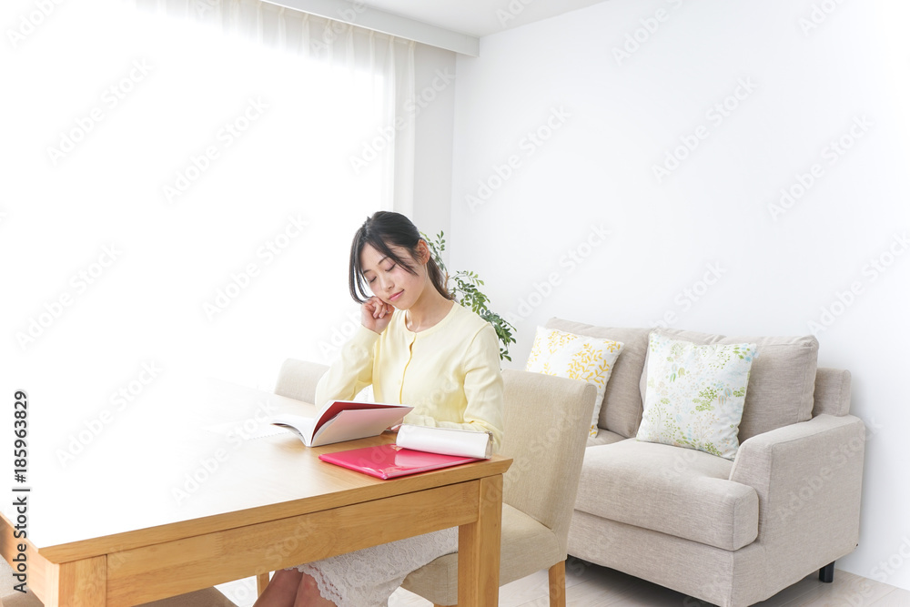 Female student studying for an entrance exam at home Female student studying for an entrance exam at home