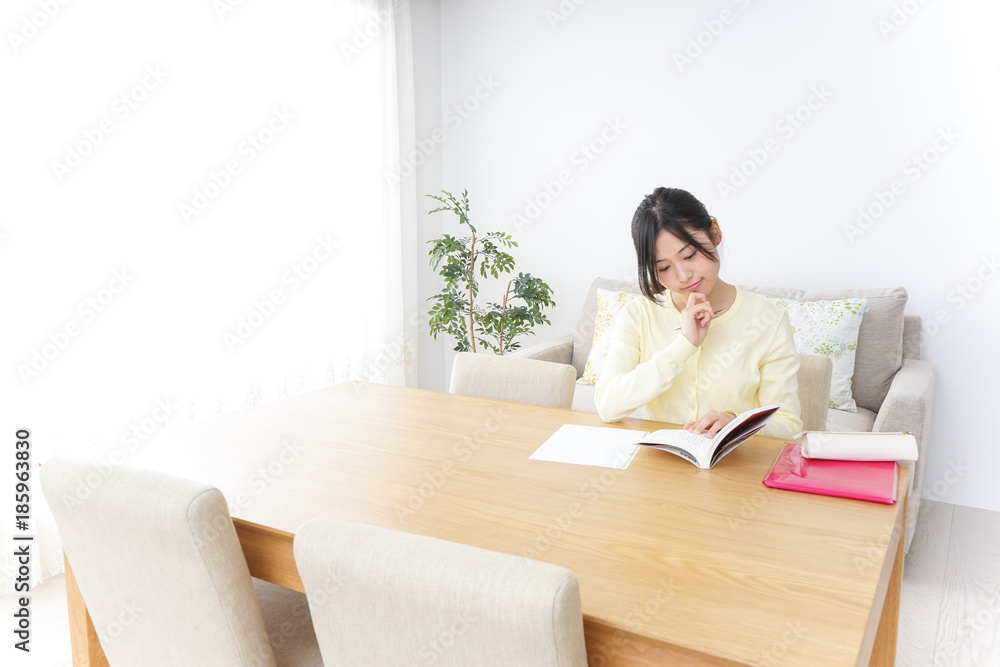 Female student studying for an entrance exam at home Female student studying for an entrance exam at home