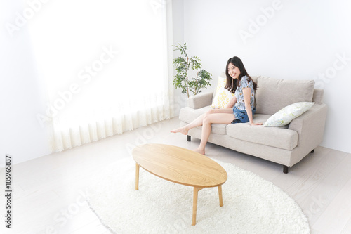 Young woman alone being relaxed at home