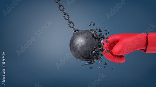 Φωτογραφία 3d rendering of swinging wrecking ball crashes when collides with a huge red boxing glove