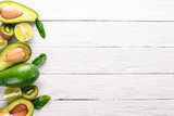 Avocado, kiwi and lime on a wooden background. Top view. Free space for your text.