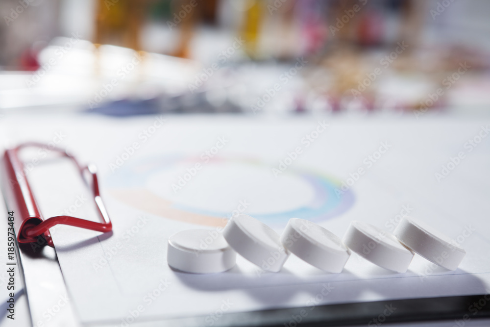 Medical marketing and Health care business analysis report. Pile of pills in blister packs background Medical marketing and Health care business analysis report. Pile of pills in blister packs background