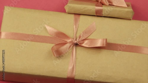 Wallpaper Mural Two beige boxes with pink bows on a pink background Torontodigital.ca