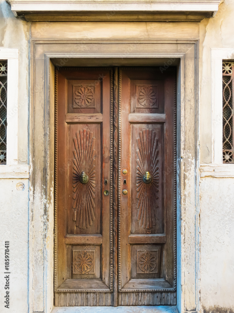 Fototapeta premium Ancient carved wooden door