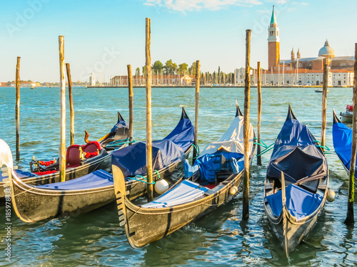 Gondolas moored in the Venetian lagoon