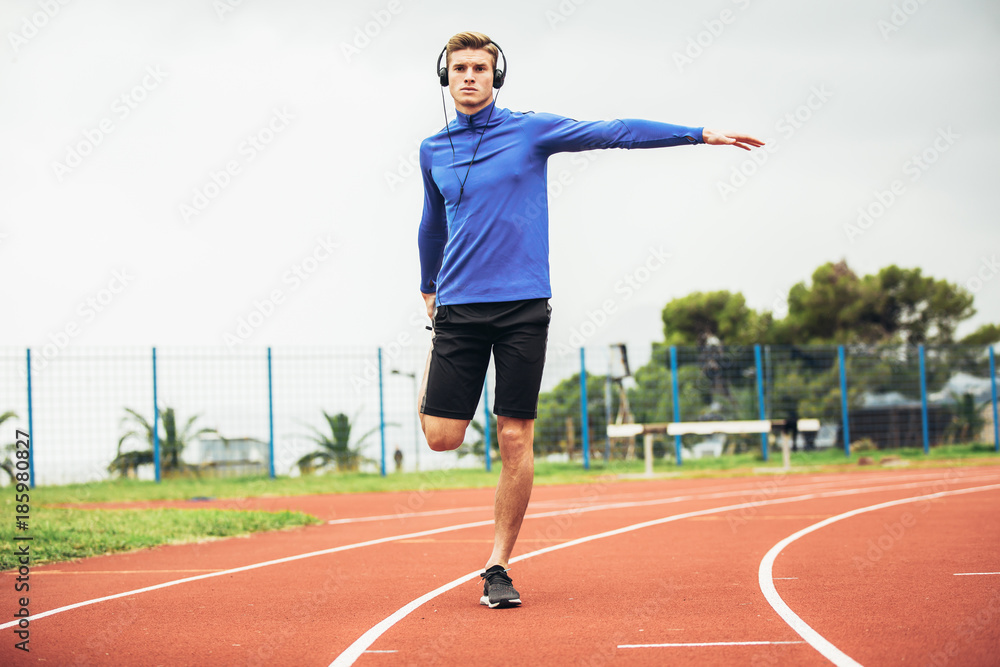 Fototapeta premium Man running on a running track