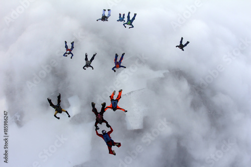 The group of skydivers in the sky.