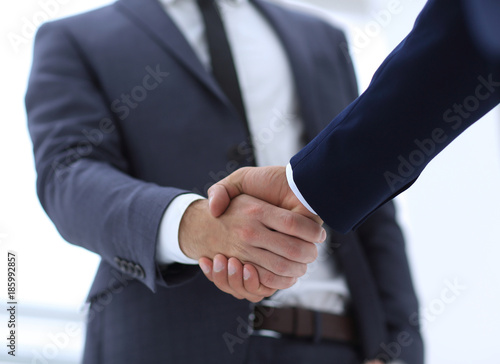 close up of two young male business partner shake hand © ASDF
