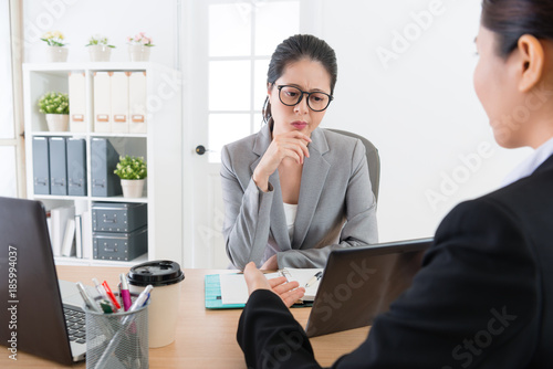young company woman boss looking at document