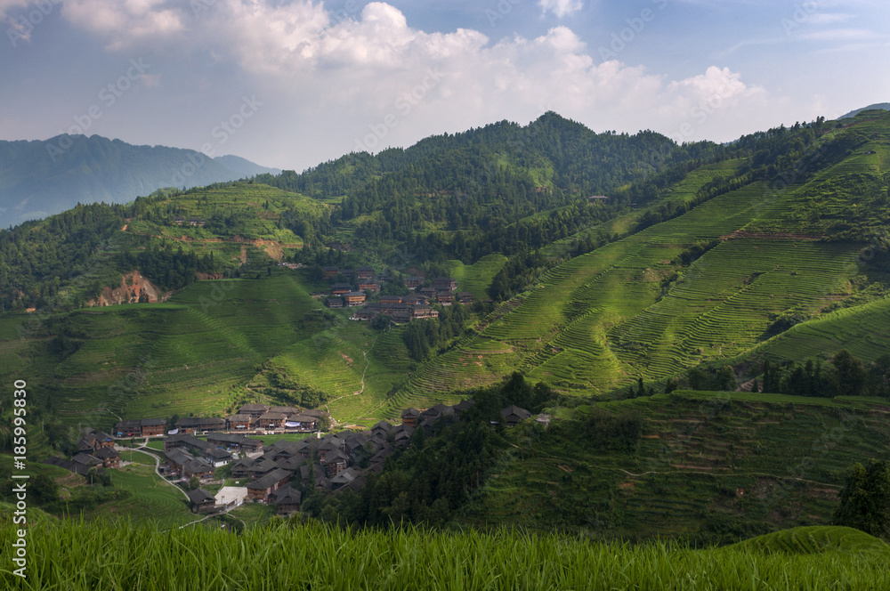 Beautiful view of the Dazhai village and the surrounding Longsheng Rice Terraces in the province of Guangxi in China; Concept for travel in China