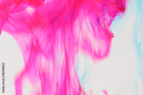 Red ink color in transparent water.