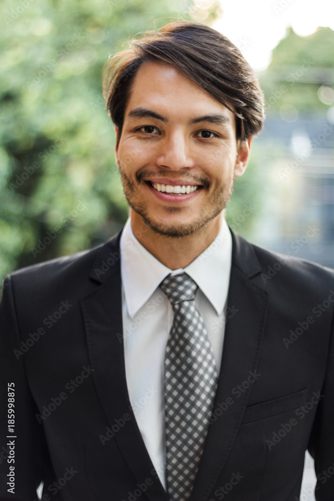 Portrait of smiling businessman outdoors Portrait of smiling businessman outdoors