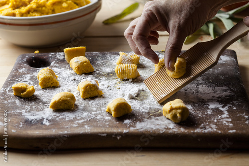 Person preparing pumpkin gnocchi
