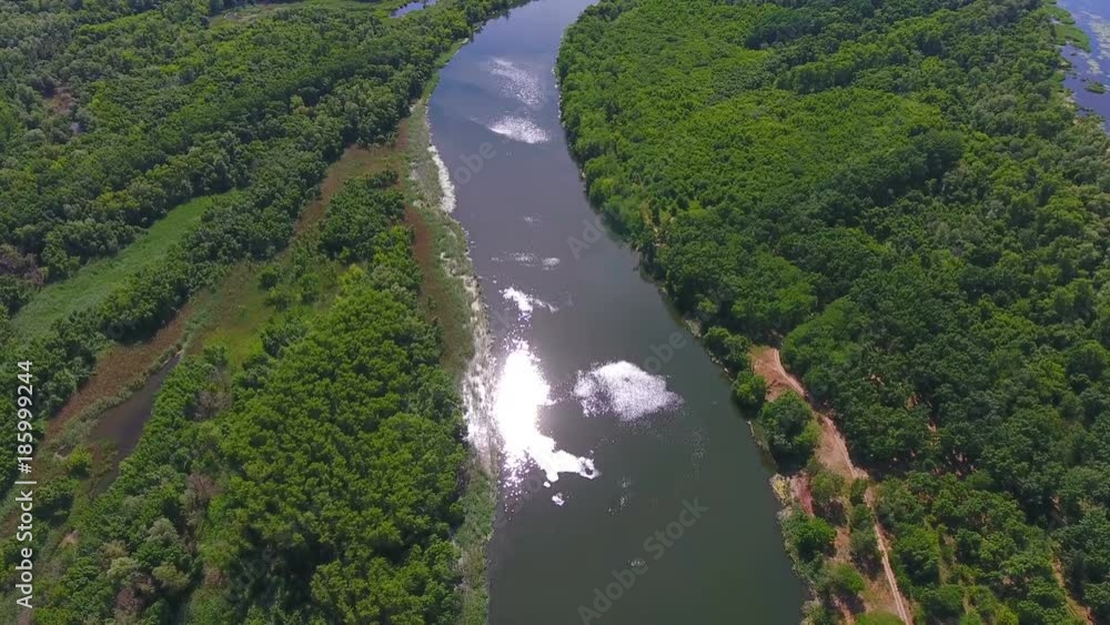 flight above small river and green forest around. aerial footage flight above small river and green forest around. aerial footage