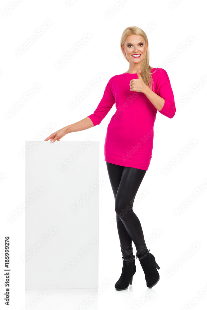 Smiling Beautiful Woman Is Posing With White Placard And Showing Thumb Up Smiling Beautiful Woman Is Posing With White Placard And Showing Thumb Up