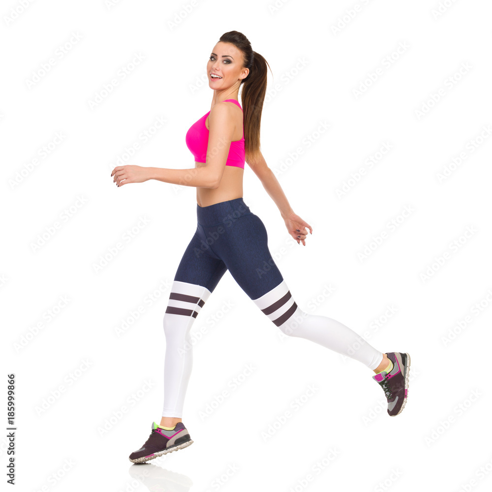 Beautiful Young Woman Is Jumping In Sports Clothes