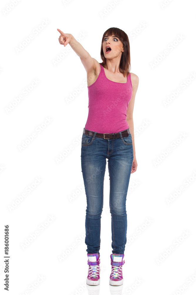 Excited Woman Is Shouting, Looking Away And Pointing Excited Woman Is Shouting, Looking Away And Pointing