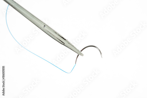 NEEDLE HOLDER AND SUTURE