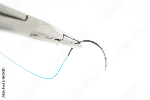 NEEDLE HOLDER AND SUTURE