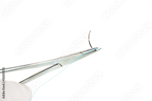 NEEDLE HOLDER AND SUTURE
