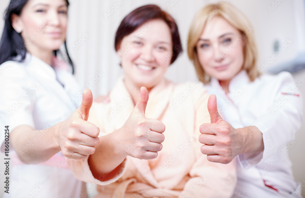 Doctors with a happy patient show like