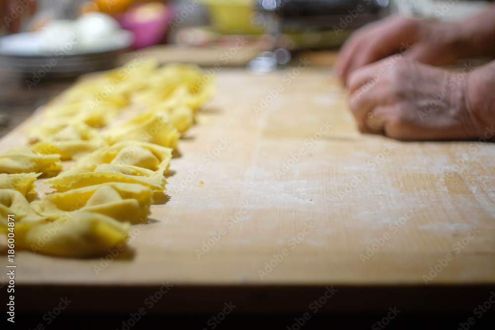 Grandmother preparing the Pumpkin Tortelli of Mantua, the original and traditional recipe from North of Italy