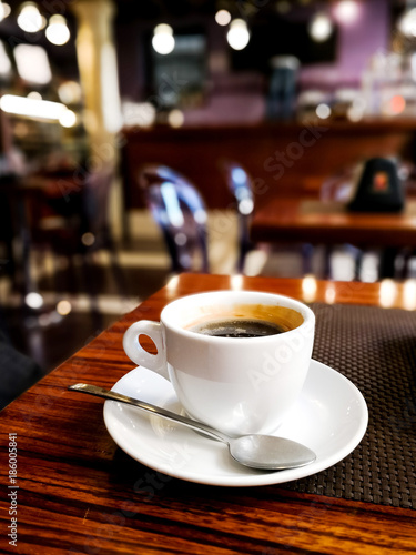 wonderful white cup of hot coffee on table