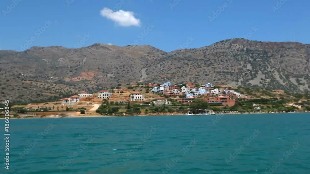 Greece. Beautiful sea coast against the background of mountains. View of the sea from the boat Greece. Beautiful sea coast against the background of mountains. View of the sea from the boat