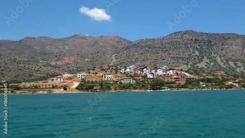 Greece. Beautiful sea coast against the background of mountains. View of the sea from the boat photo