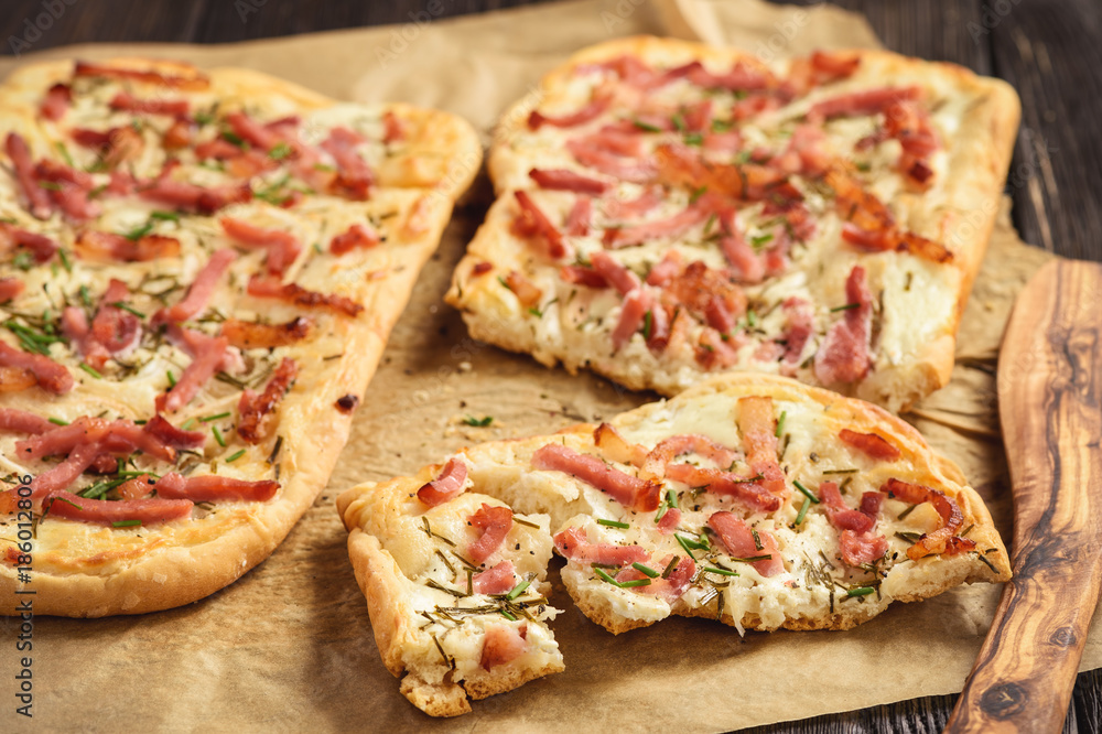 Tarte flambee, traditional alsatian pizza. Tarte flambee, traditional alsatian pizza.