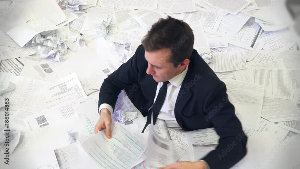 the man in the office drowning in paper the man in the office drowning in paper