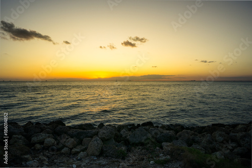 USA  Florida  Romantic orange sunset at rocky coast of key biscayne with reflecting ocean