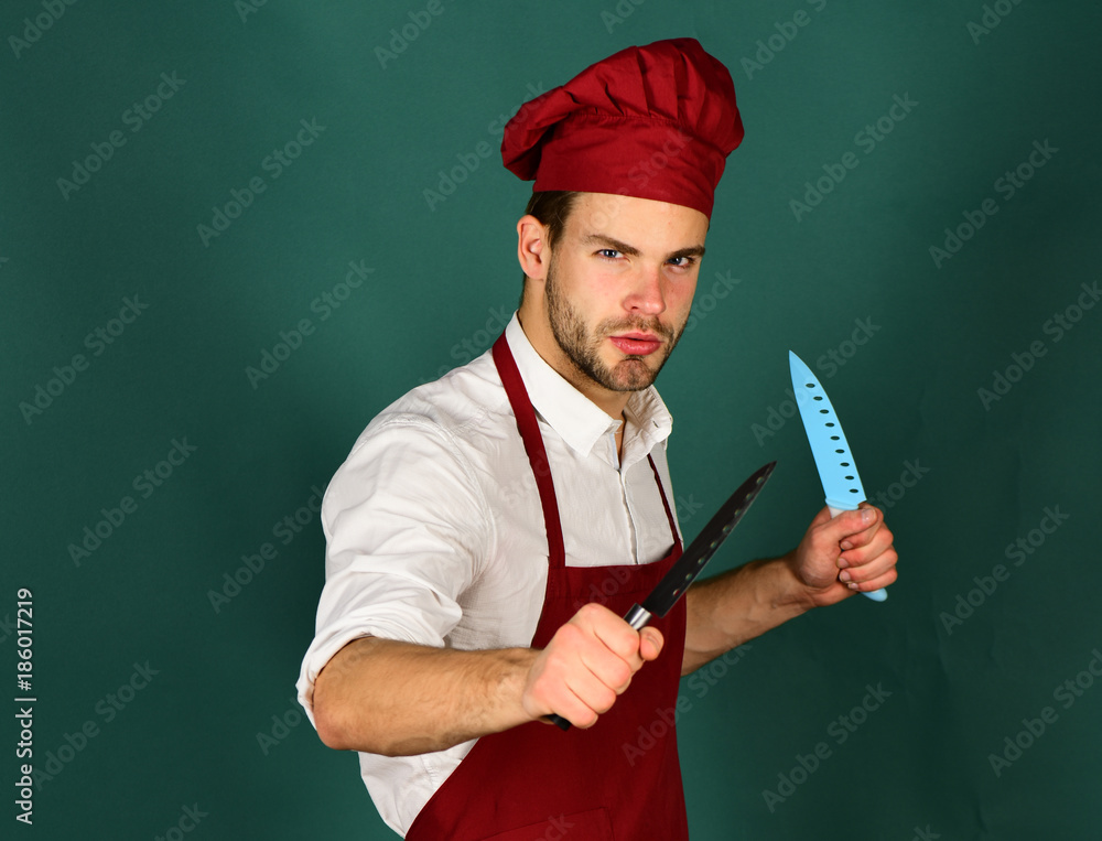 Naklejka premium Kitchenware and cooking concept. Cook works in kitchen.