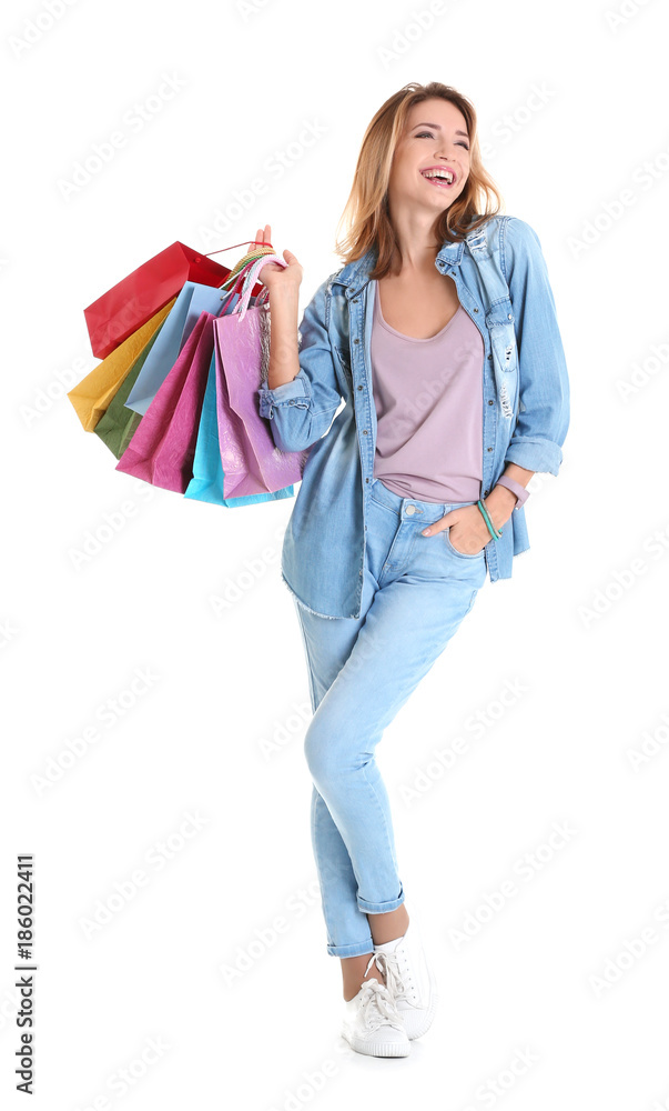 Happy young woman with shopping bags on white background Happy young woman with shopping bags on white background