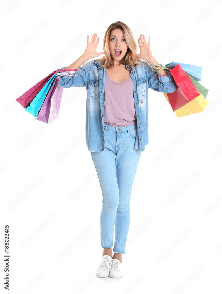Shocked young woman with shopping bags on white background Shocked young woman with shopping bags on white background
