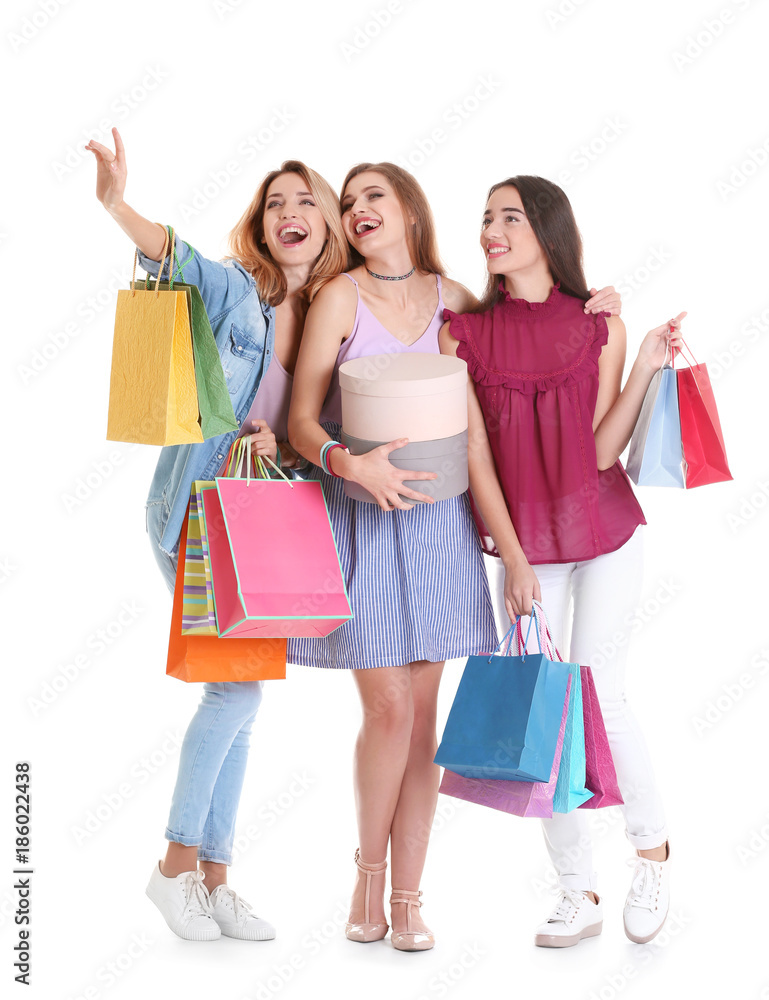 Happy young women with shopping bags and boxes on white background Happy young women with shopping bags and boxes on white background