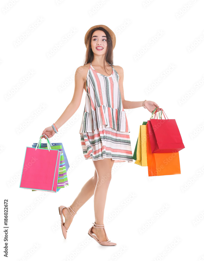 Happy young woman with shopping bags on white background Happy young woman with shopping bags on white background