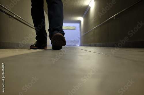 man walks in the underpass