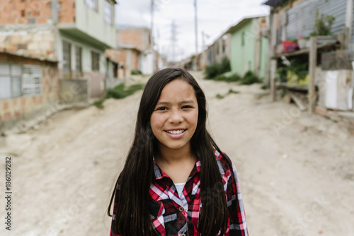 Photography Portrait of beautiful girl in shanty town.
