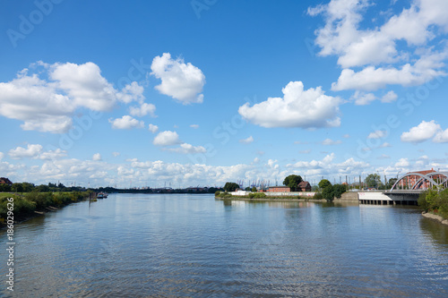 The port channel of Hamburg on a sunny day. Blue sky with clouds