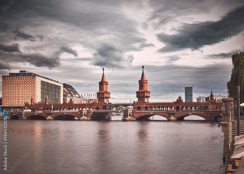Fototapeta premium Berlin cathedral, Berliner Dom, suggestive winter atmosphere, people walking and cycling in front of cathedral