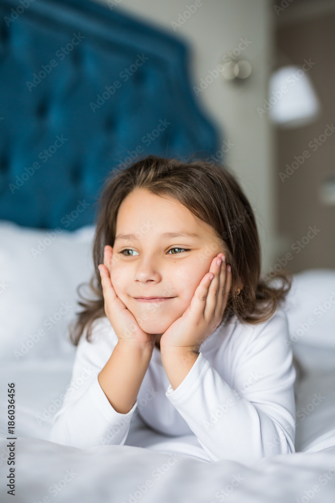 Portrait of beautiful girl, dreaming in bed. Beauty little girl in bed at home. Portrait of beautiful girl, dreaming in bed. Beauty little girl in bed at home.