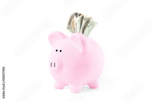 Piggy bank and coins on white background