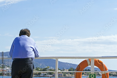 a man looks away from the ship