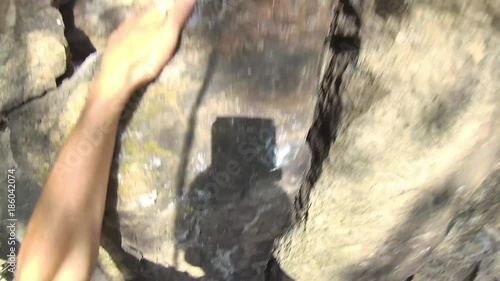 a younger man climbs to the rock,  rock climbing equipment, Free climbing, a clip from his perspective, 4k