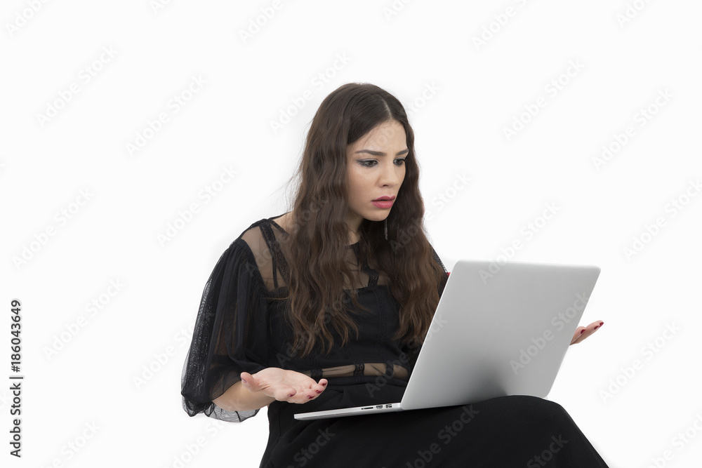 The beautiful lady is using a laptop computer The beautiful lady is using a laptop computer