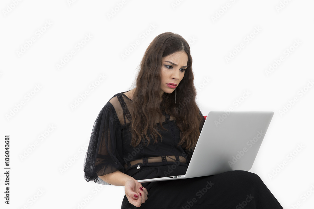 The beautiful lady is using a laptop computer