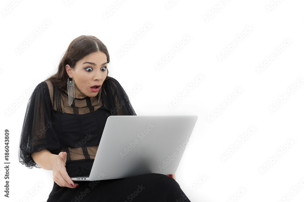 The beautiful lady is using a laptop computer The beautiful lady is using a laptop computer
