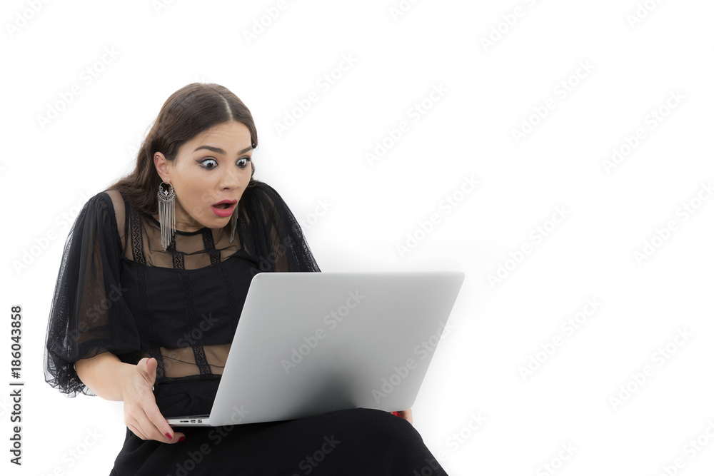 The beautiful lady is using a laptop computer The beautiful lady is using a laptop computer