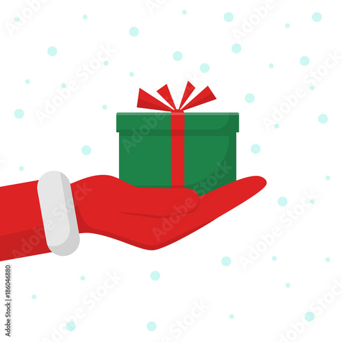 Gift from Santa Claus. Santa Claus holding gteen gift box in hand, shows gift. Vector illustration flat design. Merry Christmas and Happy New Year on snowy background.